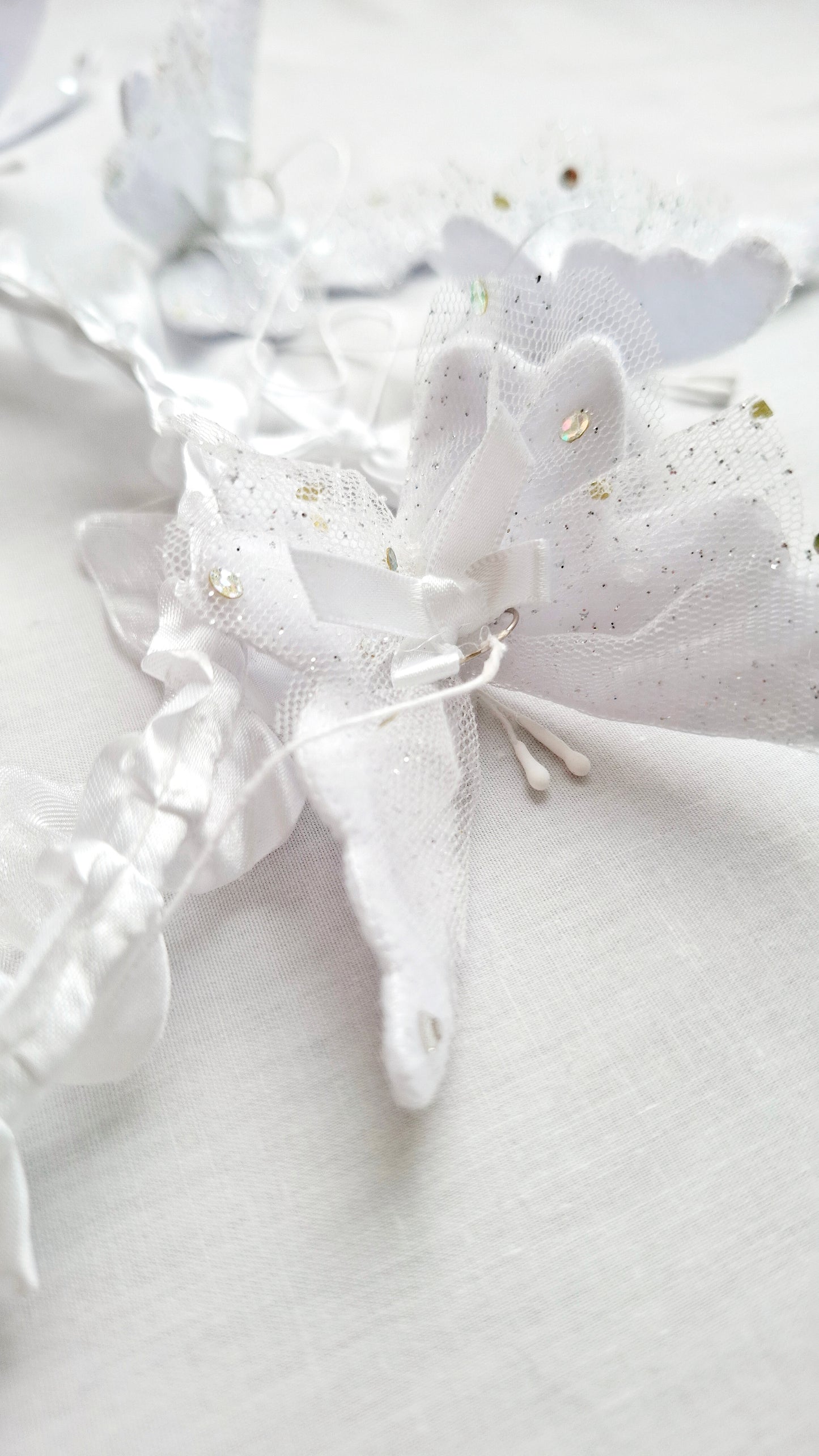 Luxury handcrafted baby mobile with layered white butterflies and intricate lace details, perfect for high-end baby spaces.