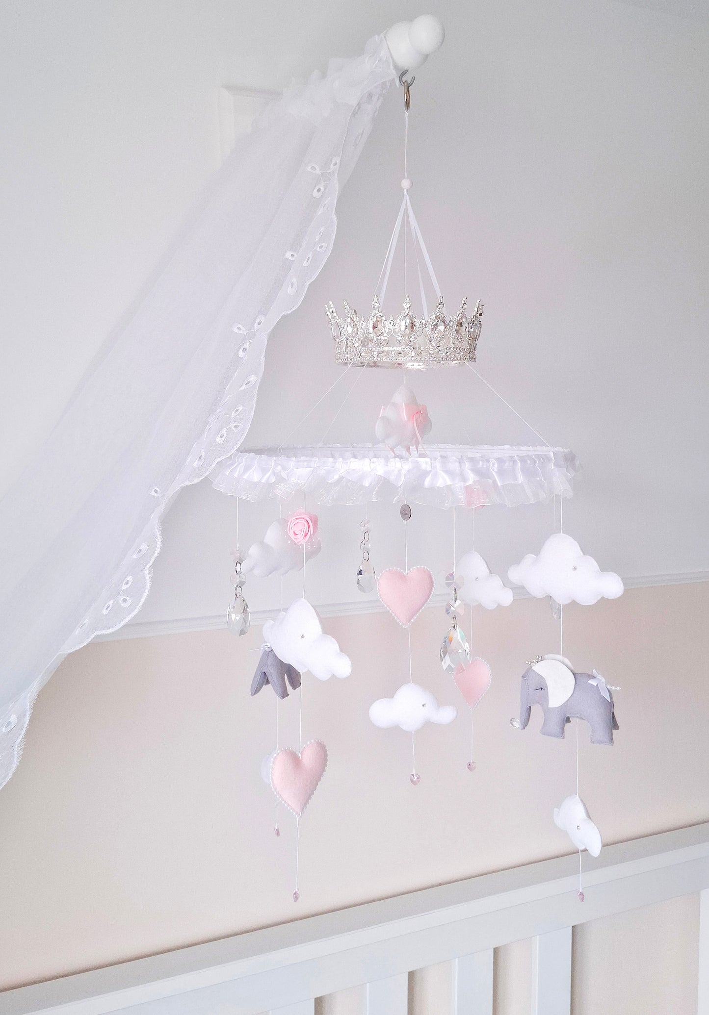 Soft pink and white baby mobile with clouds, hearts, and elegant elephants, designed for a luxury baby girl’s nursery.