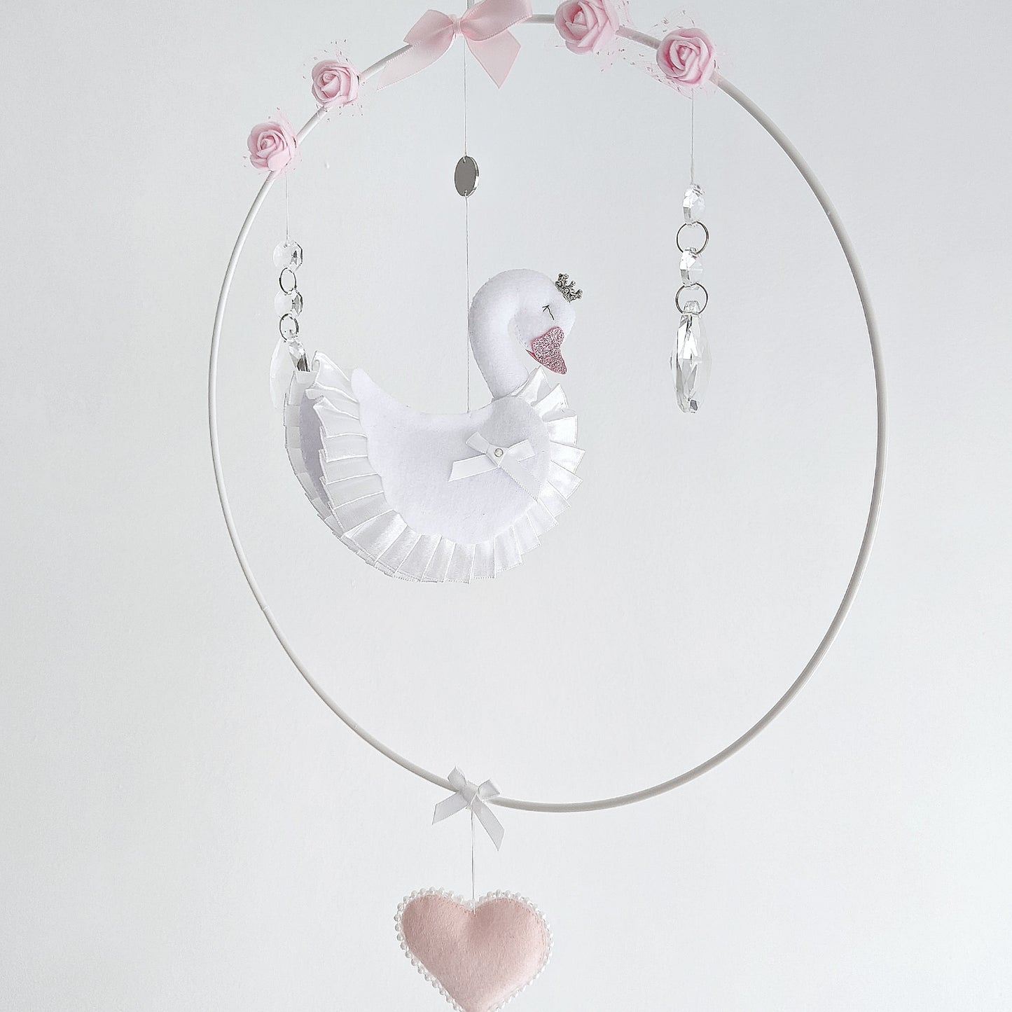 Personalised swan wall charm featuring baby’s name on soft felt heart, luxury handcrafted keepsake for baby showers or christenings.
