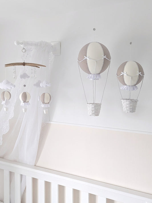  Taupe and ivory hot air balloon wall decorations with soft ruffles and woven baskets, gently floating side by side.