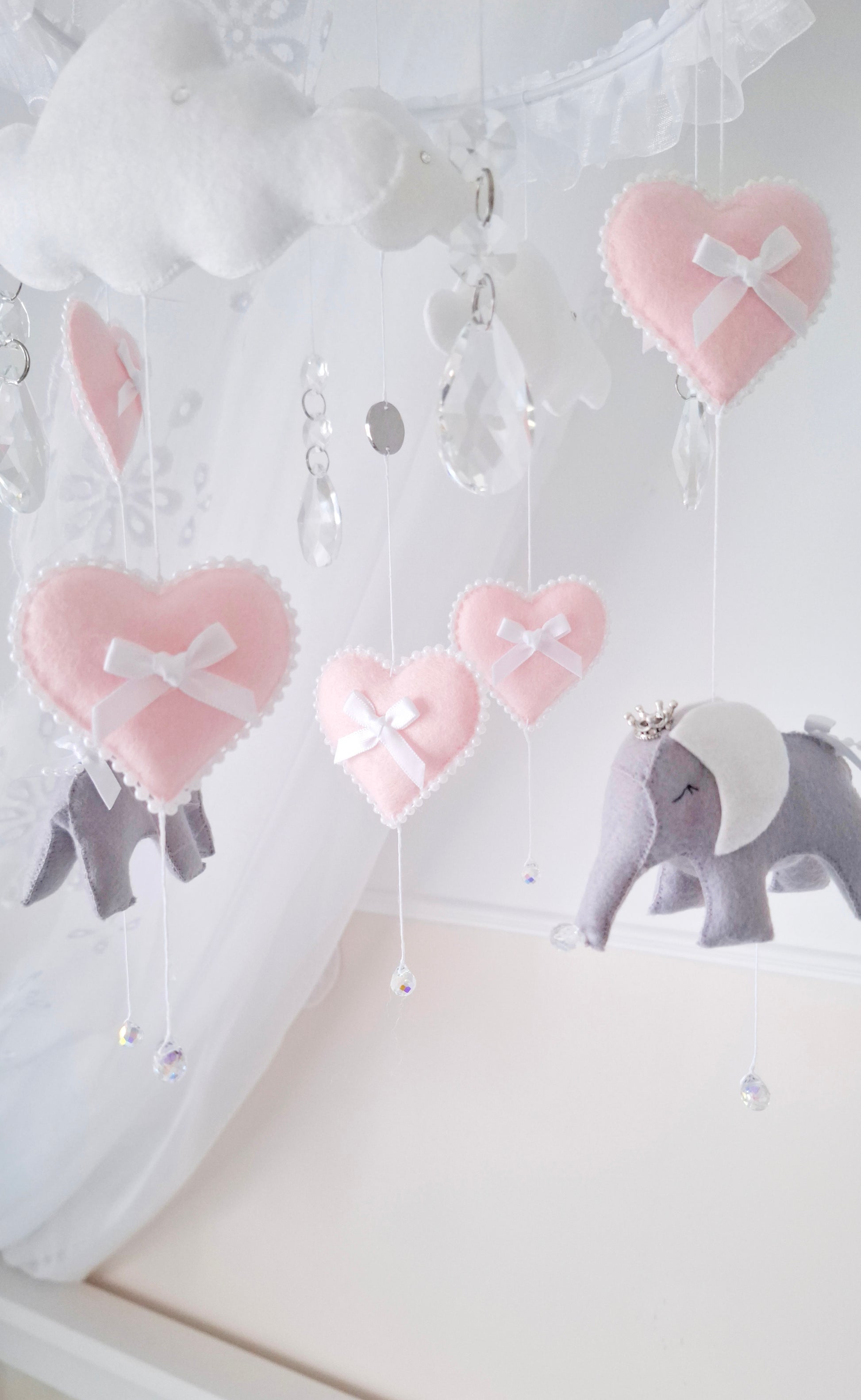 Luxury baby girl mobile with soft felt elephants, ruffled hanger, and pink hearts—ideal for a dreamy, feminine nursery.

