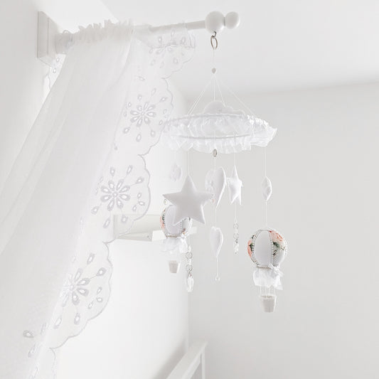 Luxury baby mobile with blush floral hot air balloons, stars, hearts, and clouds on a round lace trimmed hanger.