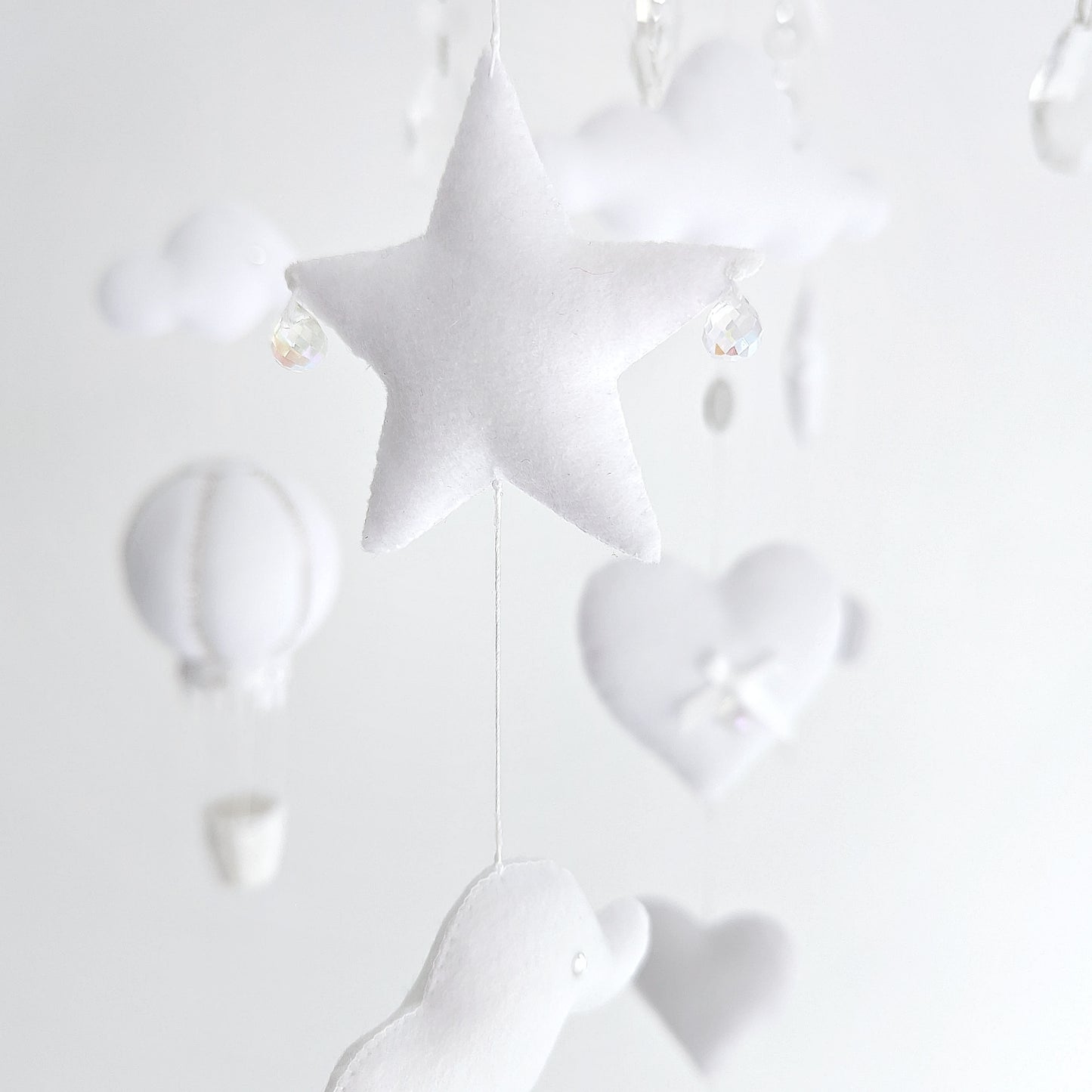 Balloon-themed luxury mobile in soft white, designed with clouds, hearts, and a timeless aesthetic.
