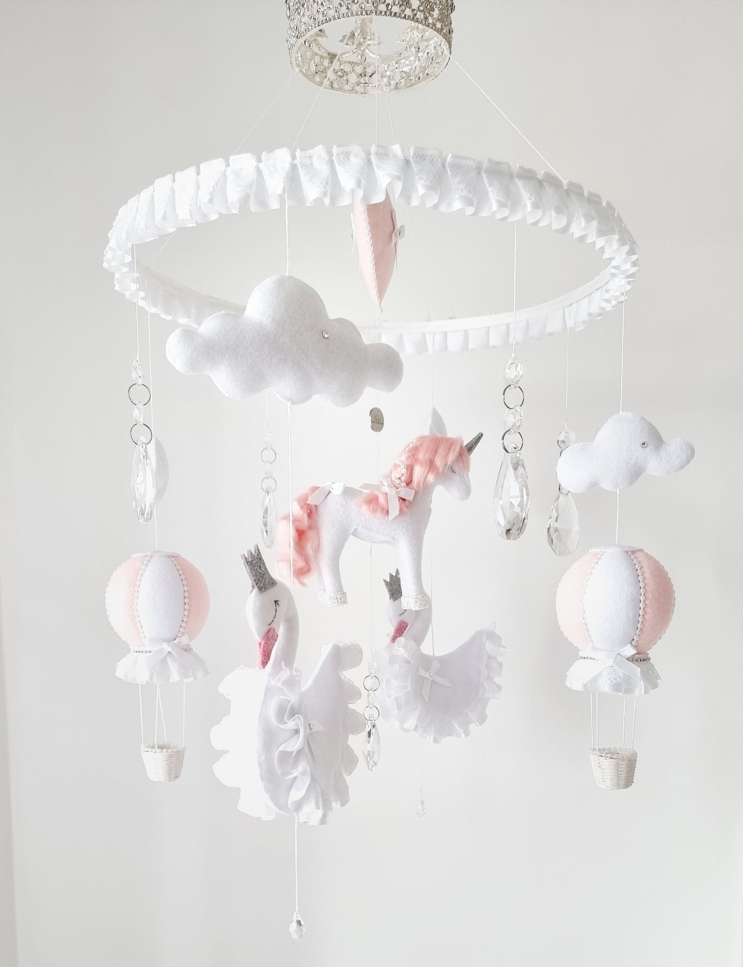  Elegant baby mobile crowned in sparkle, with delicate felt unicorns, cloud puffs, and soft crystal accents for a royal touch.

