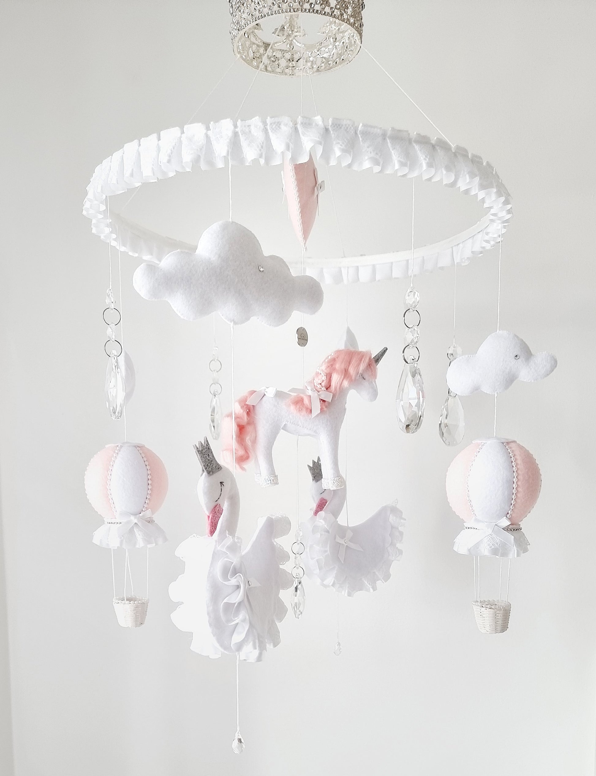  Elegant baby mobile crowned in sparkle, with delicate felt unicorns, cloud puffs, and soft crystal accents for a royal touch.

