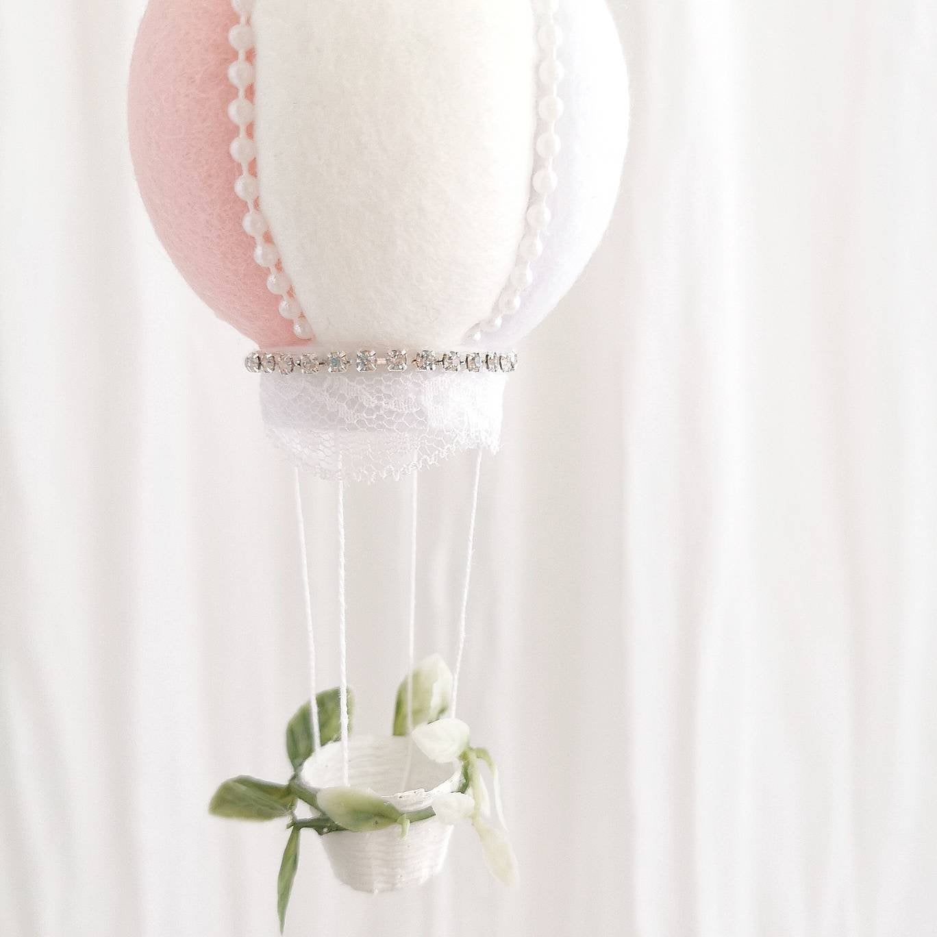 Heirloom luxury baby mobile with faux roses, ruffled peonies, and a exclusive hot air balloon in blush and white