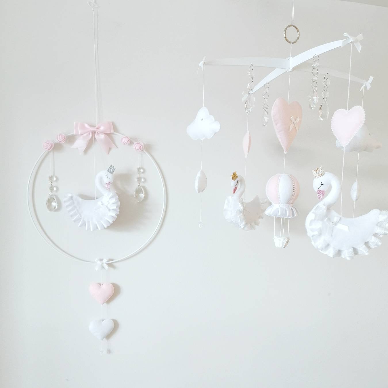 Heirloom swan baby mobile with delicate florals and heart accents, perfect for a dreamy girl's nursery.