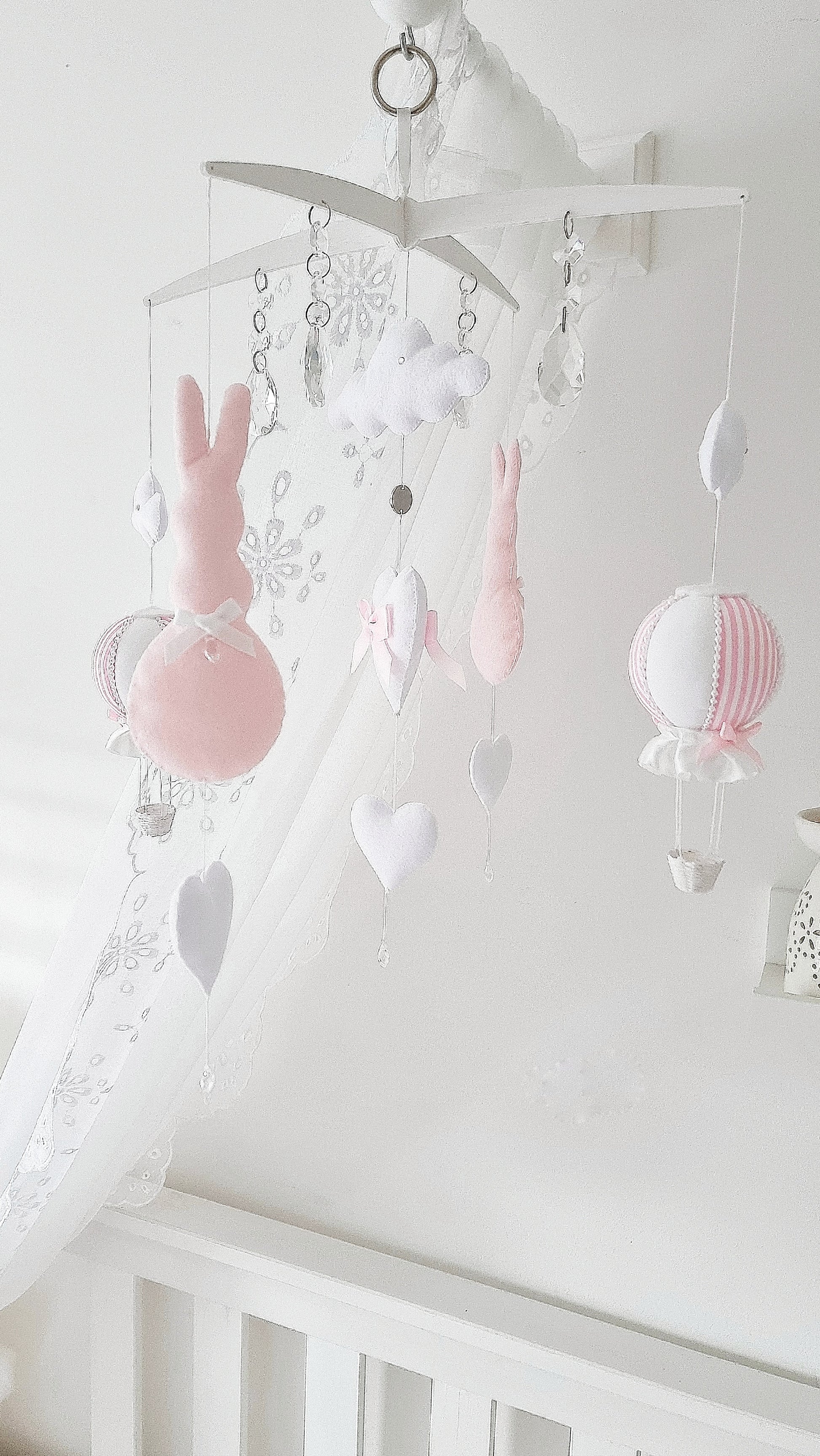  Luxury baby girl mobile with white clouds, blush hearts, and a sweet pink-and-white balloon for dreamy nursery décor.

