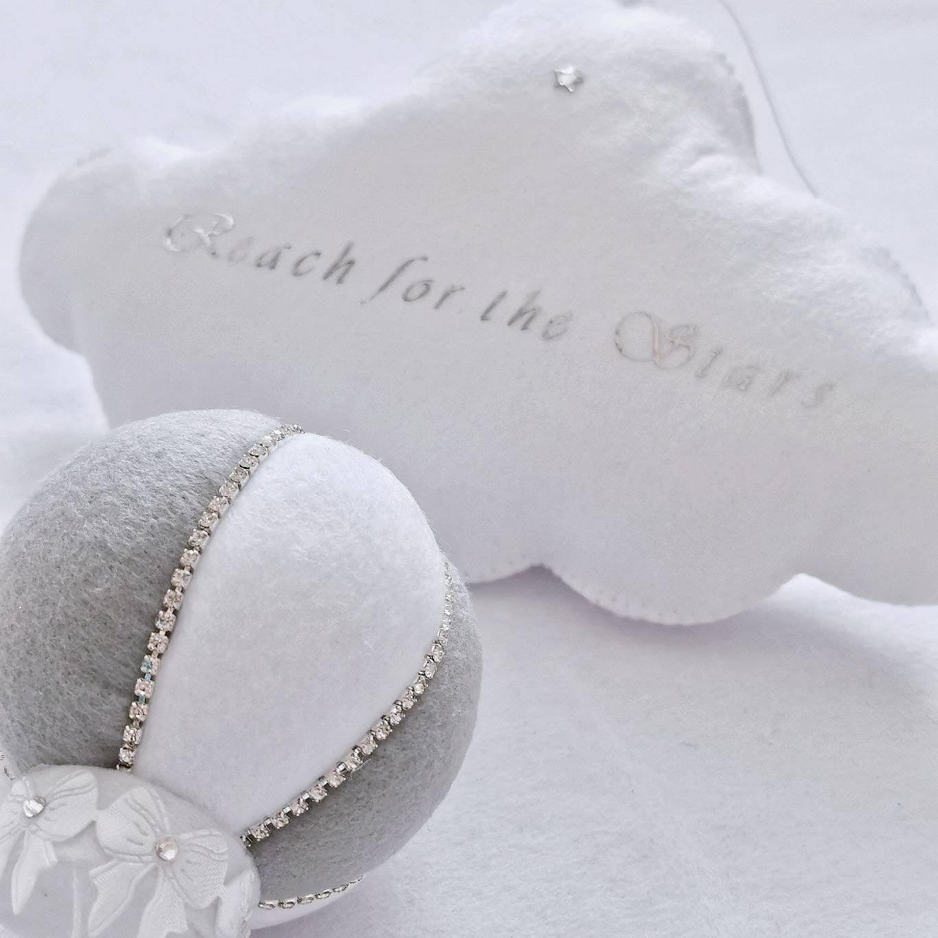 Luxury hot air balloon in soft grey and white tones with pearl trim and delicate felt leaves, perfect for a modern nursery.