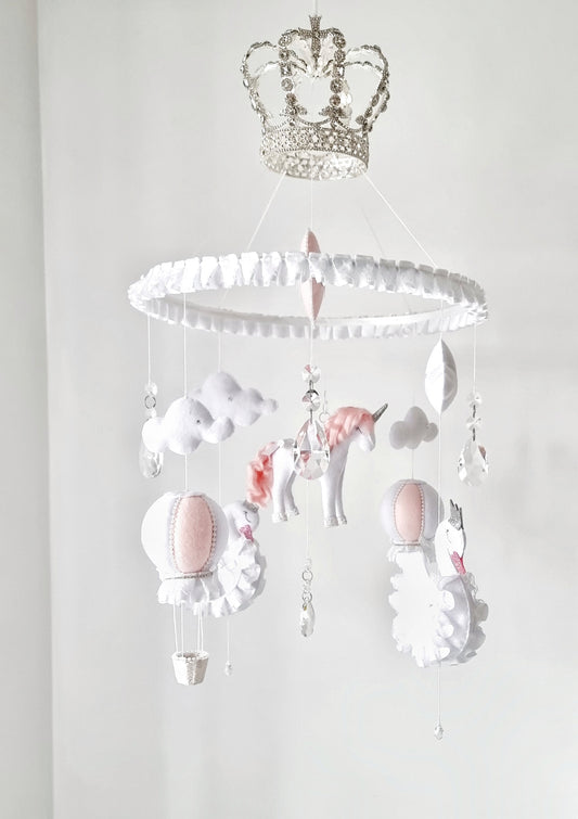 Luxury baby mobile with a sparkling crown, hand-stitched unicorn, and soft clouds, designed for a fairy tale-inspired nursery.

