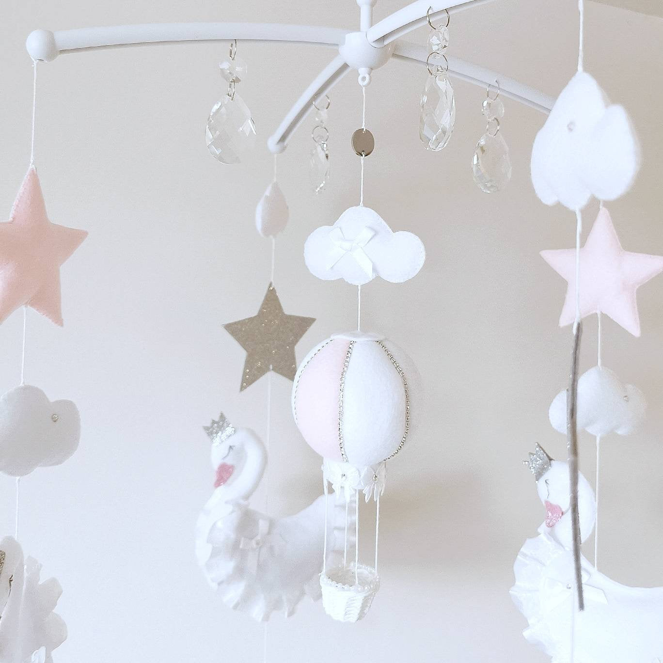 This swan mobile adds softness and charm to a nursery corner, ideal for baby showers or luxury gifting with heart