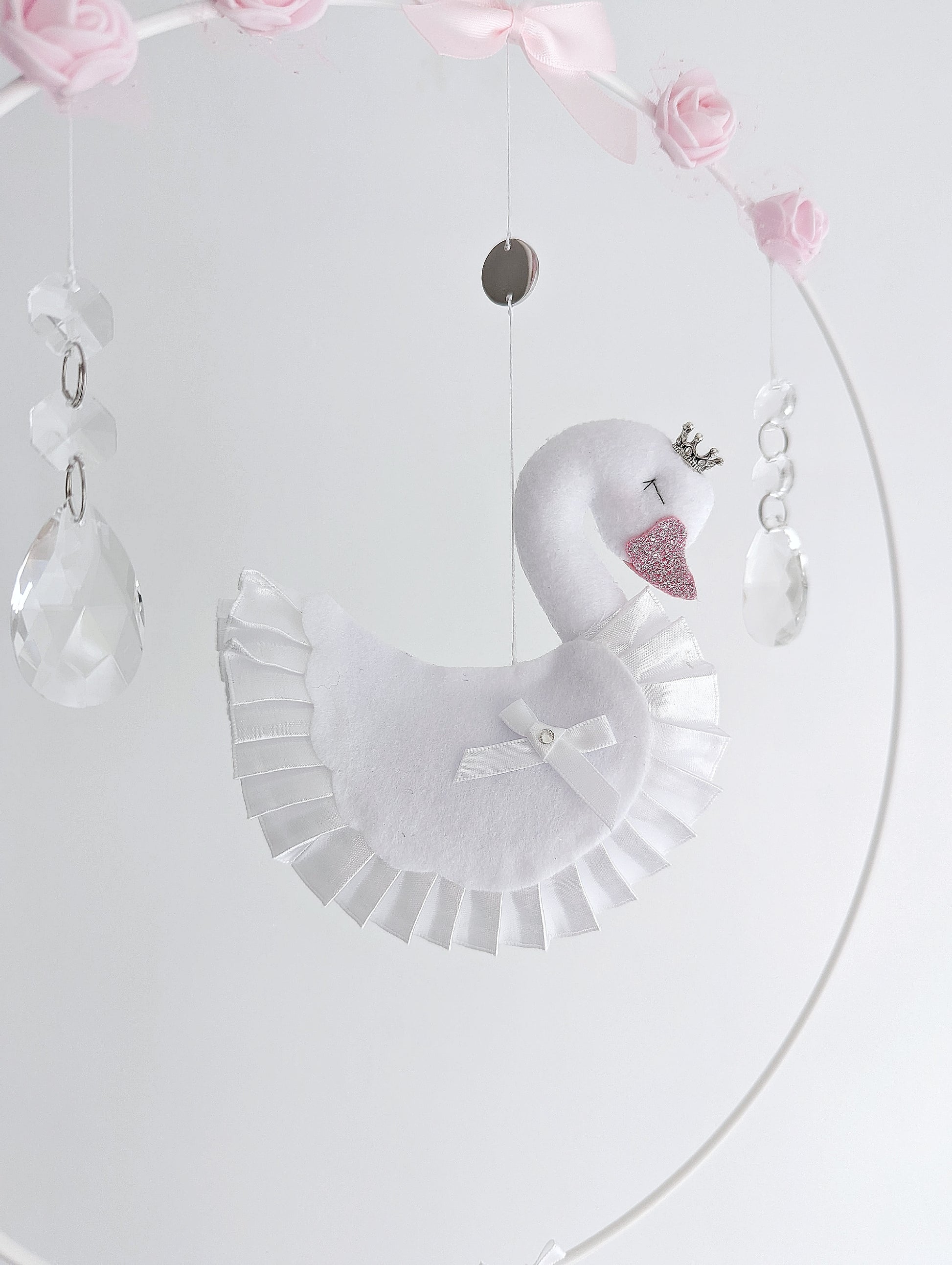 Handmade swan wall charm presented in luxury packaging, thoughtful gift idea for new baby girl or elegant nursery reveal.